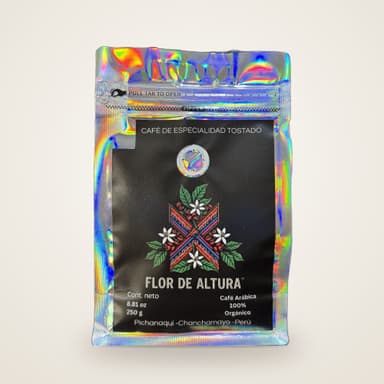 Bolsa holográfica de 250 g de café Flor de Altura, con etiqueta negra y logotipo de flores
